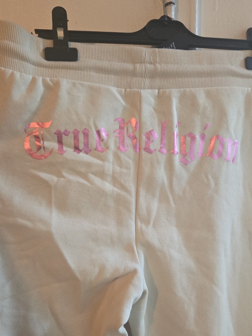 True Religion Womens Cream Joggers with Pink Holographic Logo And Flare Legs.